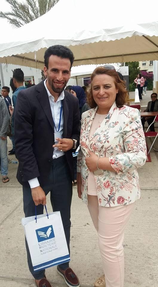 Ismail Essabar with a guest at a careers fair