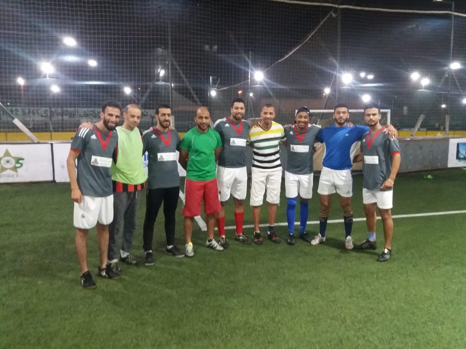 Ismail Essabar with a five-a-side football team on a pitch